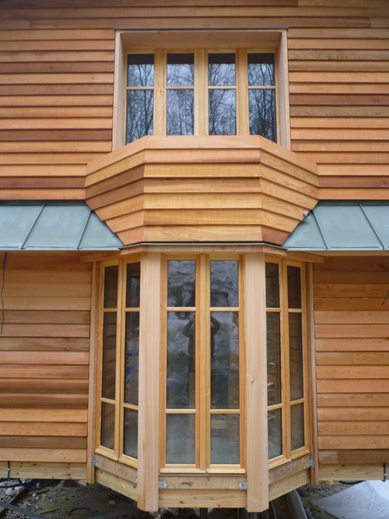 Fenêtres d'un chalet ossature bois - bardage à clin